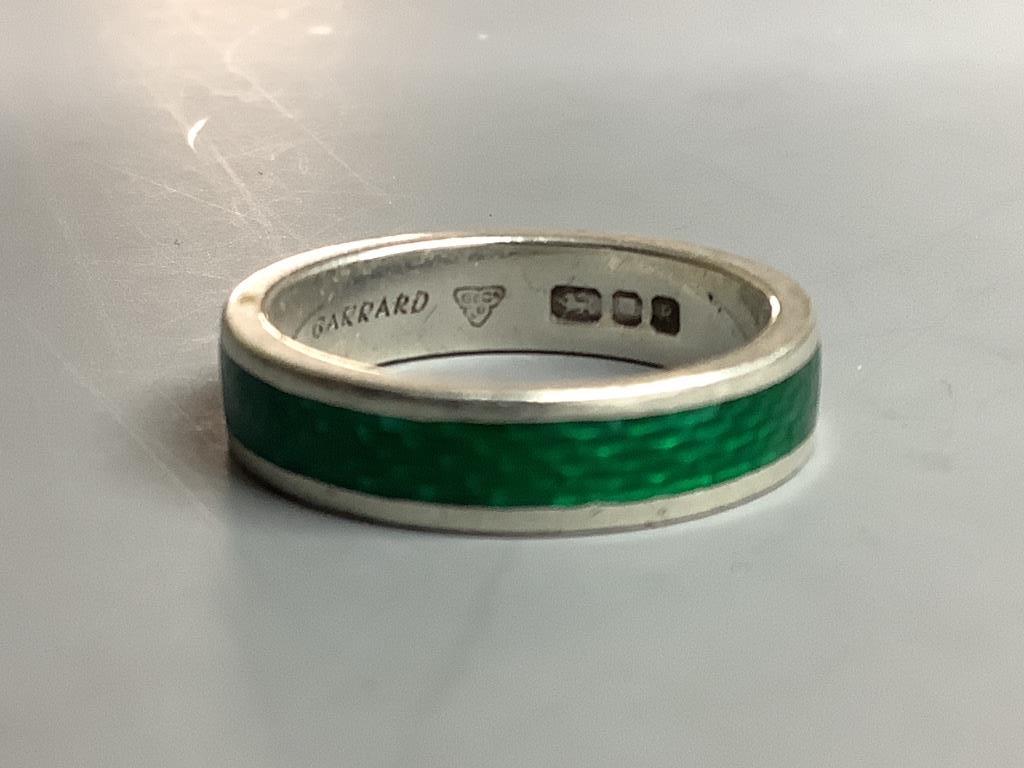 A Garrard's modern silver and green enamel band,